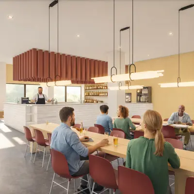 Gezellige kantoorruimte op Luttenbergweg 8 met een moderne, open lounge waar mensen ontspannen tijdens de lunchpauze. Een barista bereidt drankjes terwijl medewerkers aan tafels zitten.