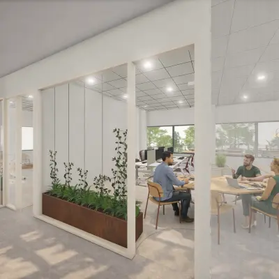 Moderne kantoorruimte in Amsterdam Zuid-Oost met open werkplekken en een glazen vergaderruimte. Meubilair en planten dragen bij aan de professionele uitstraling. Mensen zijn in overleg bezig met zakelijke activiteiten.