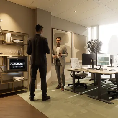 Moderne kantoorruimte huren aan de Claude Debussylaan 80-134 in Amsterdam Zuidas, met stijlvolle inrichting en collega’s in gesprek.