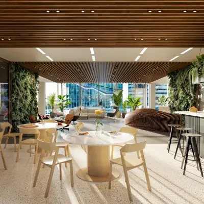 Moderne kantoorruimte in Amsterdam Zuidas met veel licht, groene planten en stijlvolle meubels. Ideaal voor het huren van kantoorruimte op Claude Debussylaan.