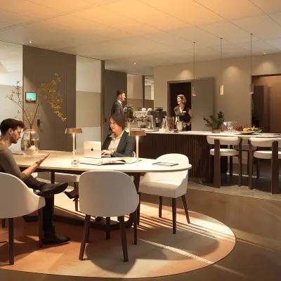 Moderne kantoorruimte huren op Claude Debussylaan 80-134 in Amsterdam Zuidas, met stijlvolle gemeubileerde werkplekken waar professionals zakelijke overleggen voeren.