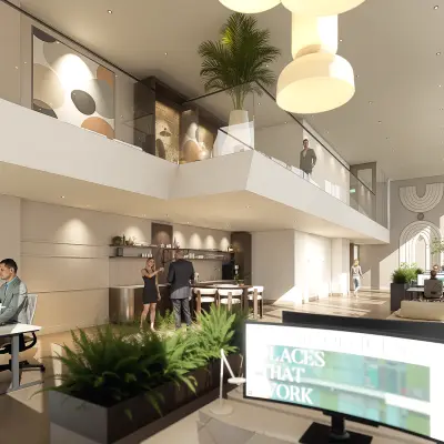 Moderne kantoorruimte te huur op de Claude Debussylaan 80-134 in Amsterdam Zuidas, met een licht interieur en stijlvolle werkplekken. Personen voeren zakelijke activiteiten uit.