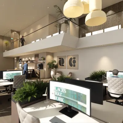 Licht en ruim opgezet kantoor in Amsterdam Zuidas op Claude Debussylaan 80-134, met moderne werkplekken en kleurrijke details. Personen voeren zakelijke activiteiten uit zoals werken aan bureaus.