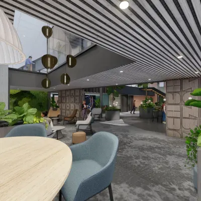 Ruime kantoorruimte met moderne inrichting in Amsterdam Zuidas, Jachthavenweg 109, geschikt voor huur. Grote ramen, stijlvolle meubels en veel groen maken het pand uitnodigend voor zakelijke activiteiten.
