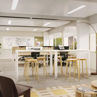 Moderne kantoorpand op Marten Meesweg 101 in Rotterdam Alexander met grote ramen, hoge tafels en planten. Ideale kantoorruimte voor huur met een open vloerplan en aangename werkplekken.