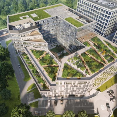 Widok z lotu ptaka na nowoczesny budynek biurowy przy Tischnera 8 w Kraków Podgórze z zielonymi tarasami i przestronnym otwartym planem.